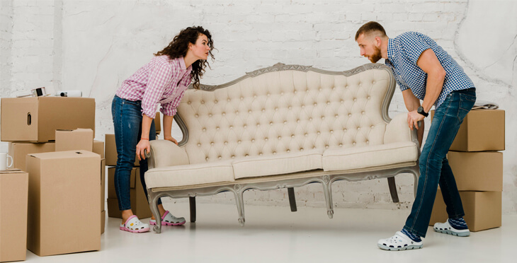 couple moving sofa on your own